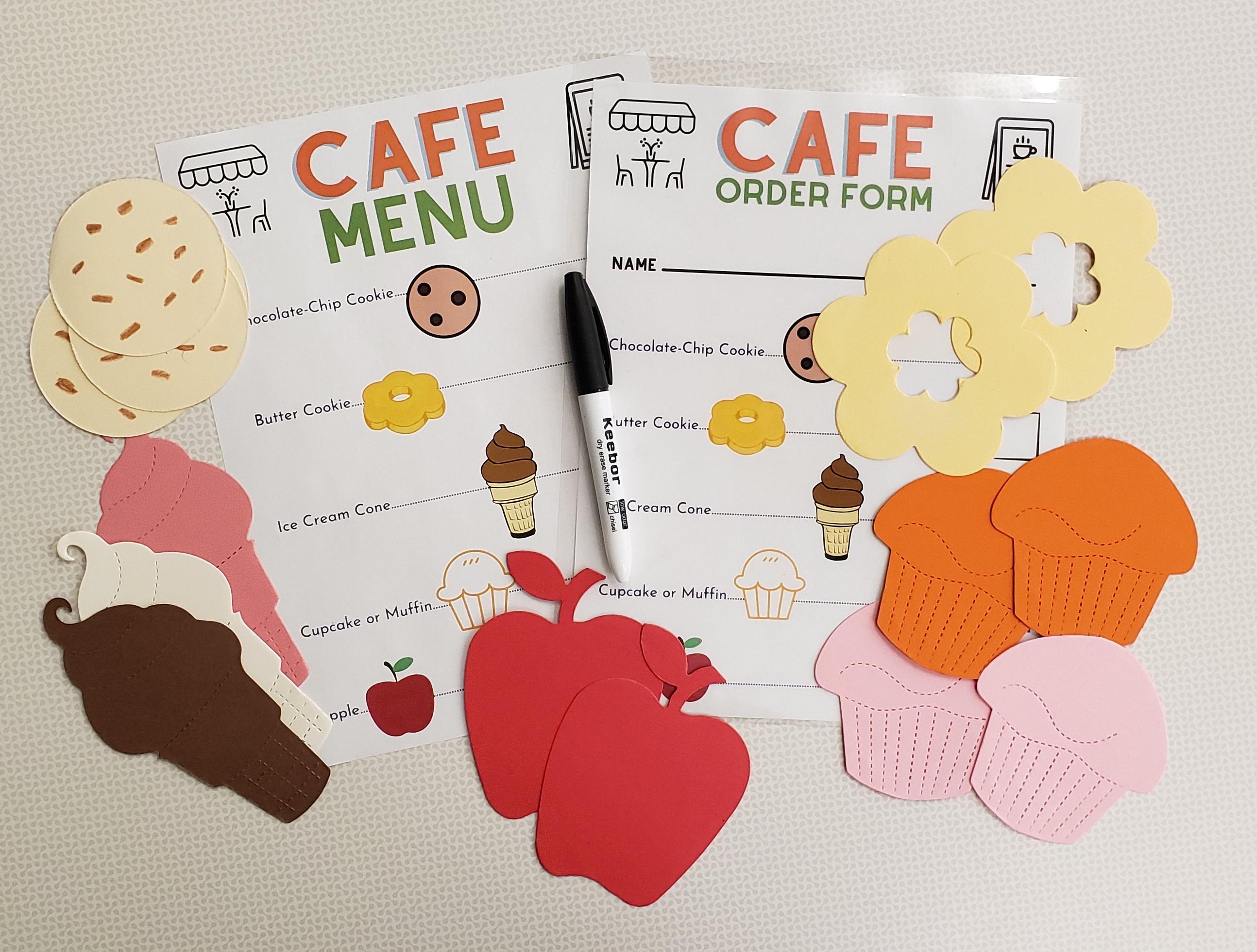 Order form, menu, dry-erase  marker, die-cut food pieces