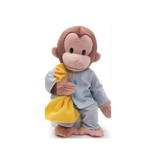 Photo of a stuffed monkey dressed in pajamas and holding a blanket.