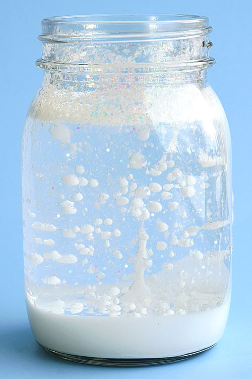 Jar in which paint and glitter resemble a snowstorm due to a chemical reaction