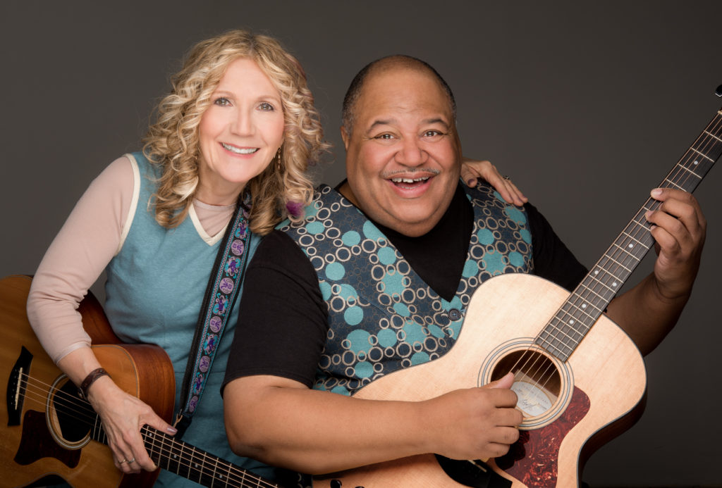 Musicians Wendy Morgan & Darryl Boggs holding guitars