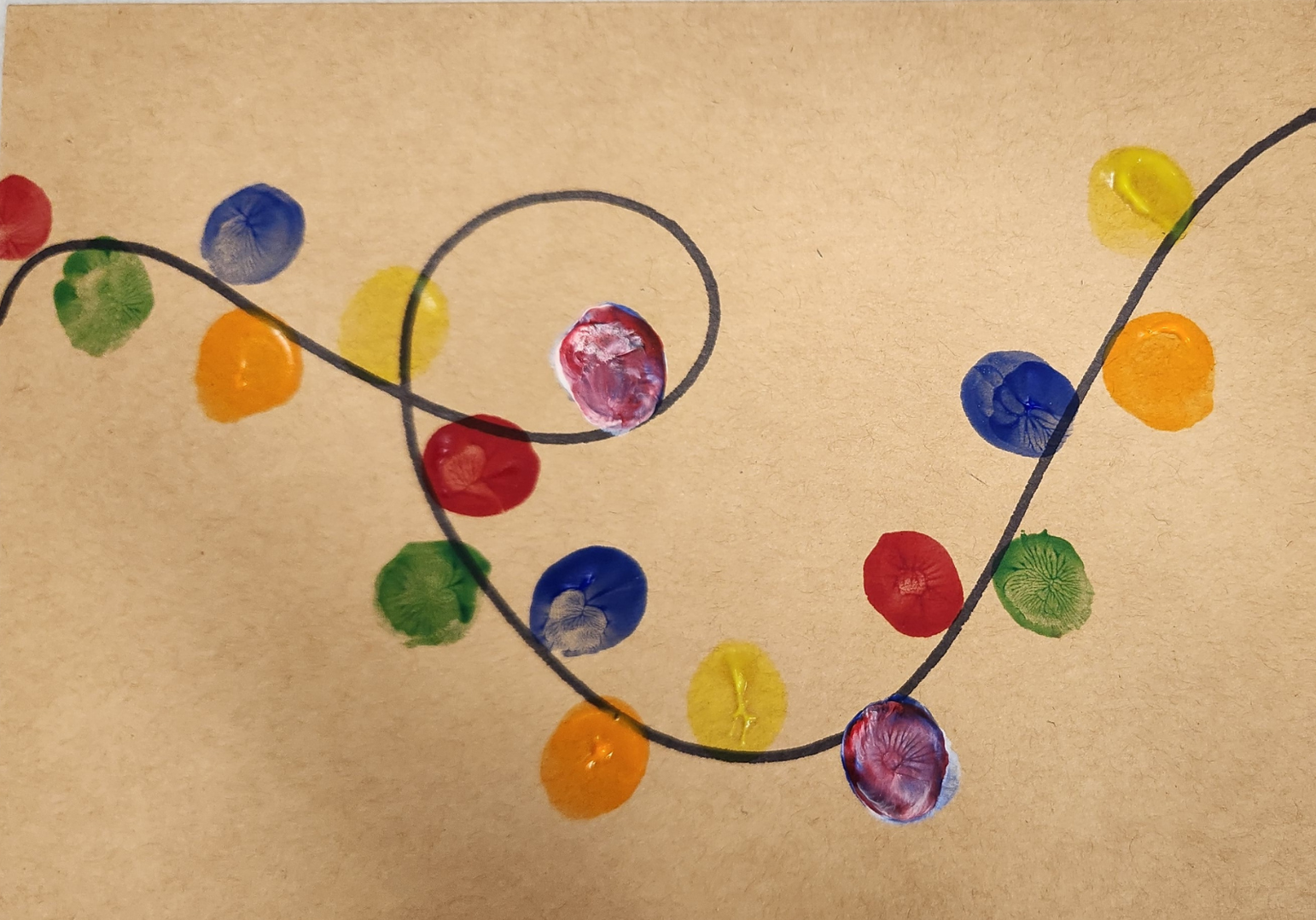 Light strand on a brown kraft paper card, with fingerprints in different colors as the light bulbs.