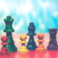 Colorful chess pieces on a bright blue background