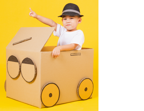 Boy in cardboard box car
